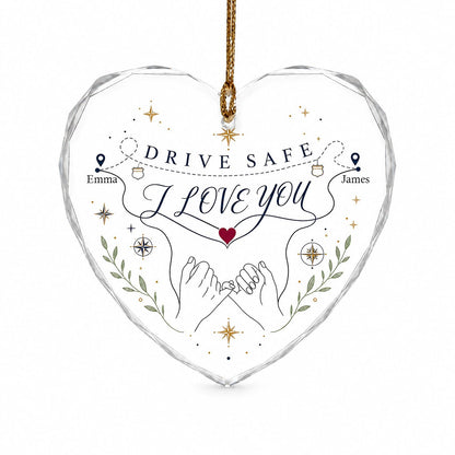 Heart glass ornament showing pinky promise hands, map pins, compass roses, green sprigs, and DRIVE SAFE and I LOVE YOU.