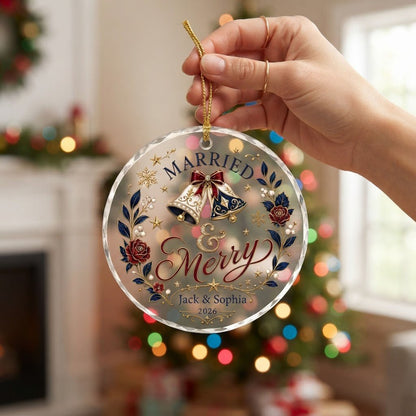 Round faceted glass ornament with two wedding bells, navy floral wreath, gold stars, and 'MARRIED' with names and year.