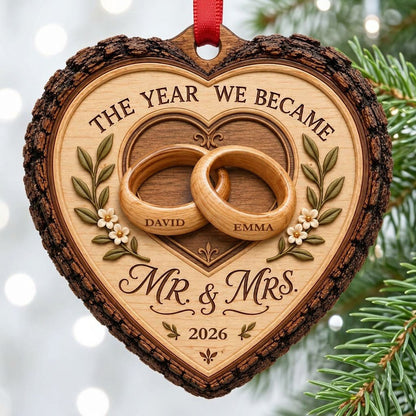 Heart-shaped wood ornament with bark edge, wedding rings, leafy vines, and 'THE YEAR WE BECAME MR. & MRS.' text.