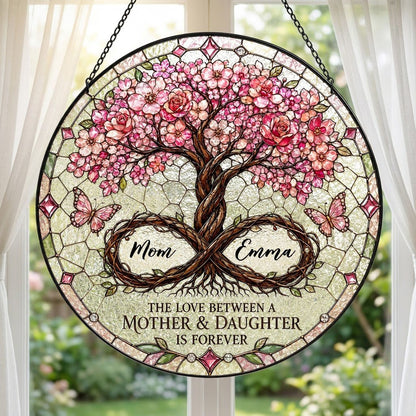 Round suncatcher with tree of life, pink blossoms, and 'THE LOVE BETWEEN A MOTHER & DAUGHTER IS FOREVER'