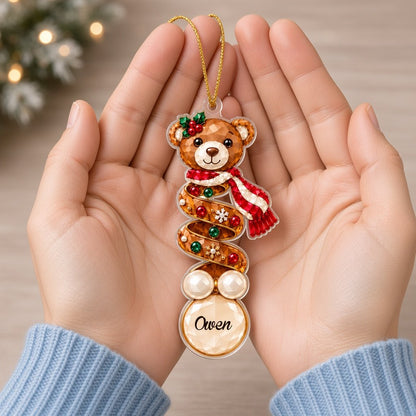 Clear acrylic ornament with a teddy bear or penguin in gem-detailed spiral style, personalized with names.