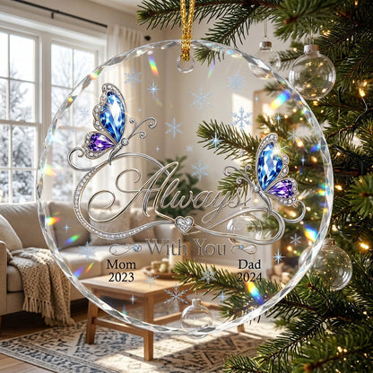 Round glass ornament with blue and purple jeweled butterflies, silver infinity heart, and light blue snowflakes.