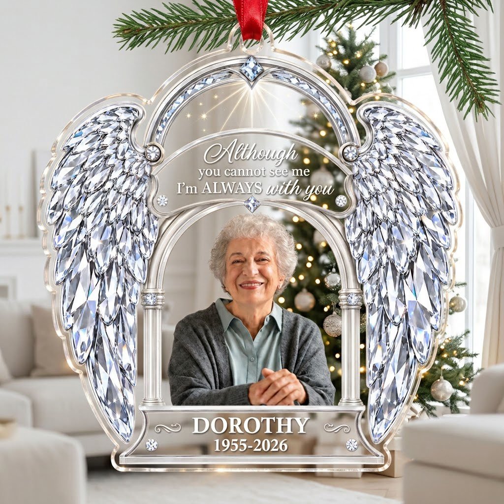 Acrylic memorial ornament with crystal angel wings, arched photo frame and wood-grain name and date banners.