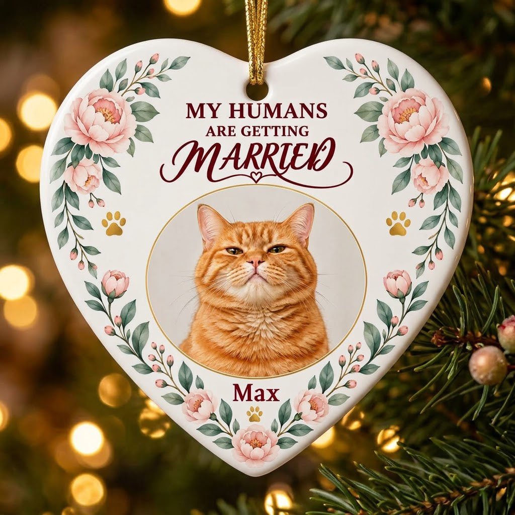Heart ceramic ornament with 'My Humans Are Getting Married,' a cat photo, pink florals, gold paw prints, and a heart ico