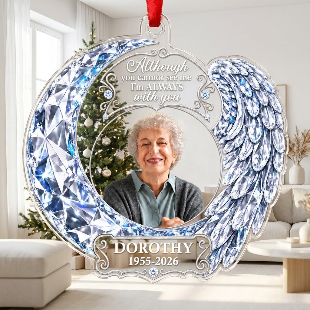 Acrylic ornament with blue crystal-look crescent moon, angel wing, circular photo frame and memorial quote.