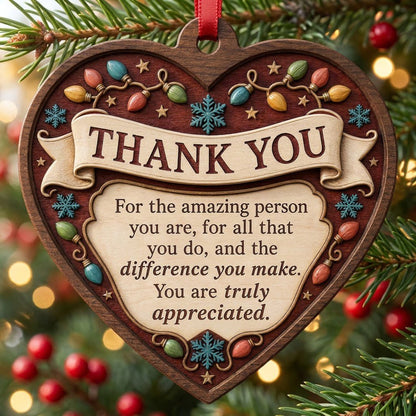 Heart-shaped wood ornament with THANK YOU message, string lights, snowflakes and stars on a burgundy background.