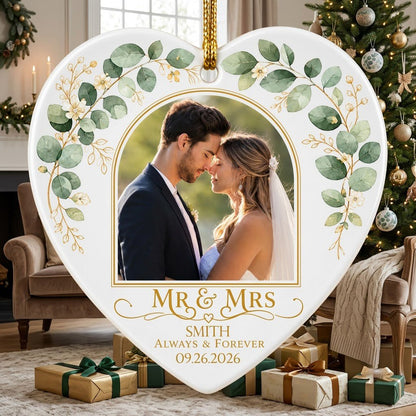 White heart ceramic ornament with wedding photo, eucalyptus leaves, gold accents, and text MR & MRS, ALWAYS & FOREVER.