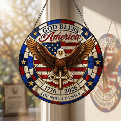 Round stained glass-look suncatcher with a bald eagle over a gold cross and an American flag shield with family name.