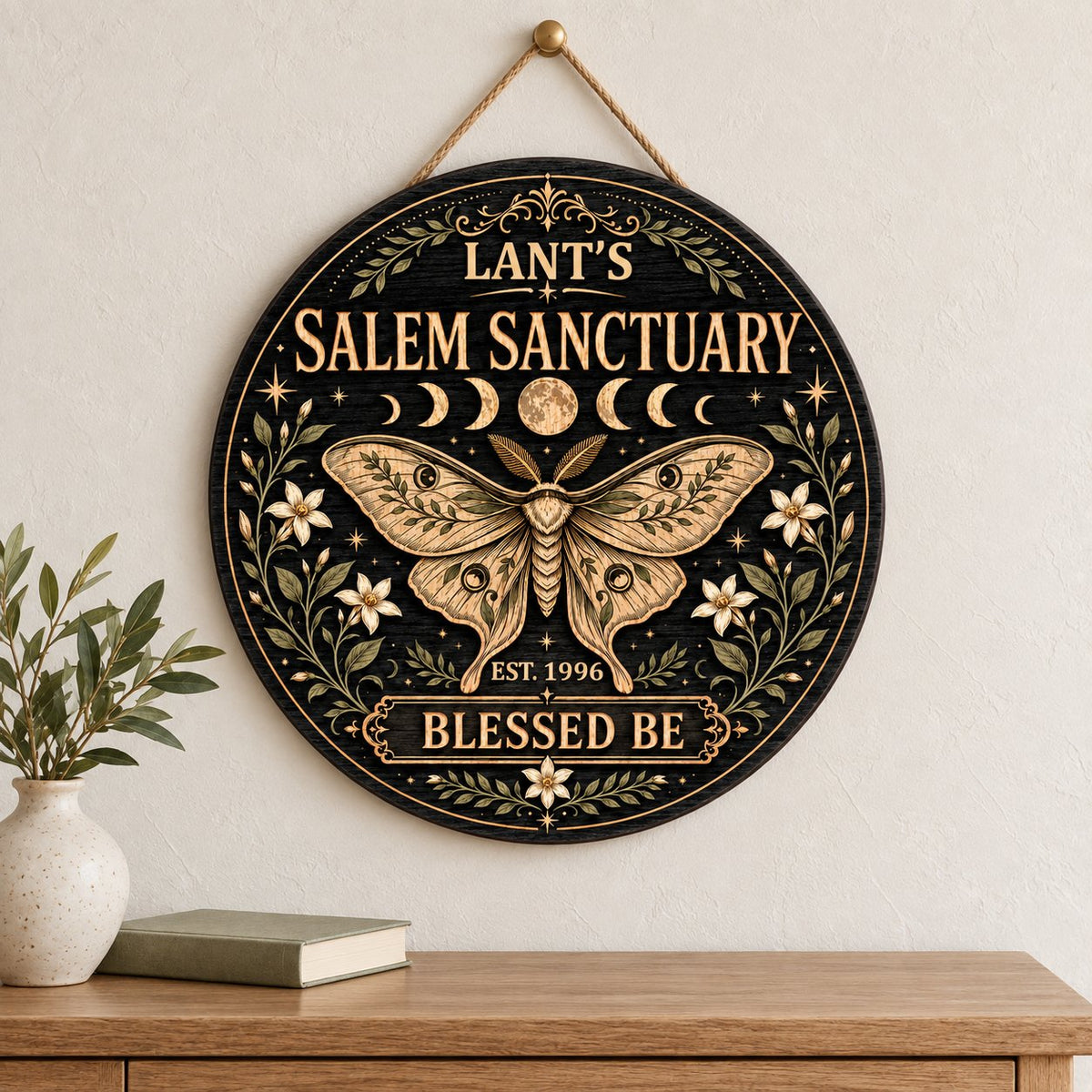Round wooden sign with a central moth, moon phases, floral vines, stars, and 'Salem Sanctuary' 'Blessed Be' text.