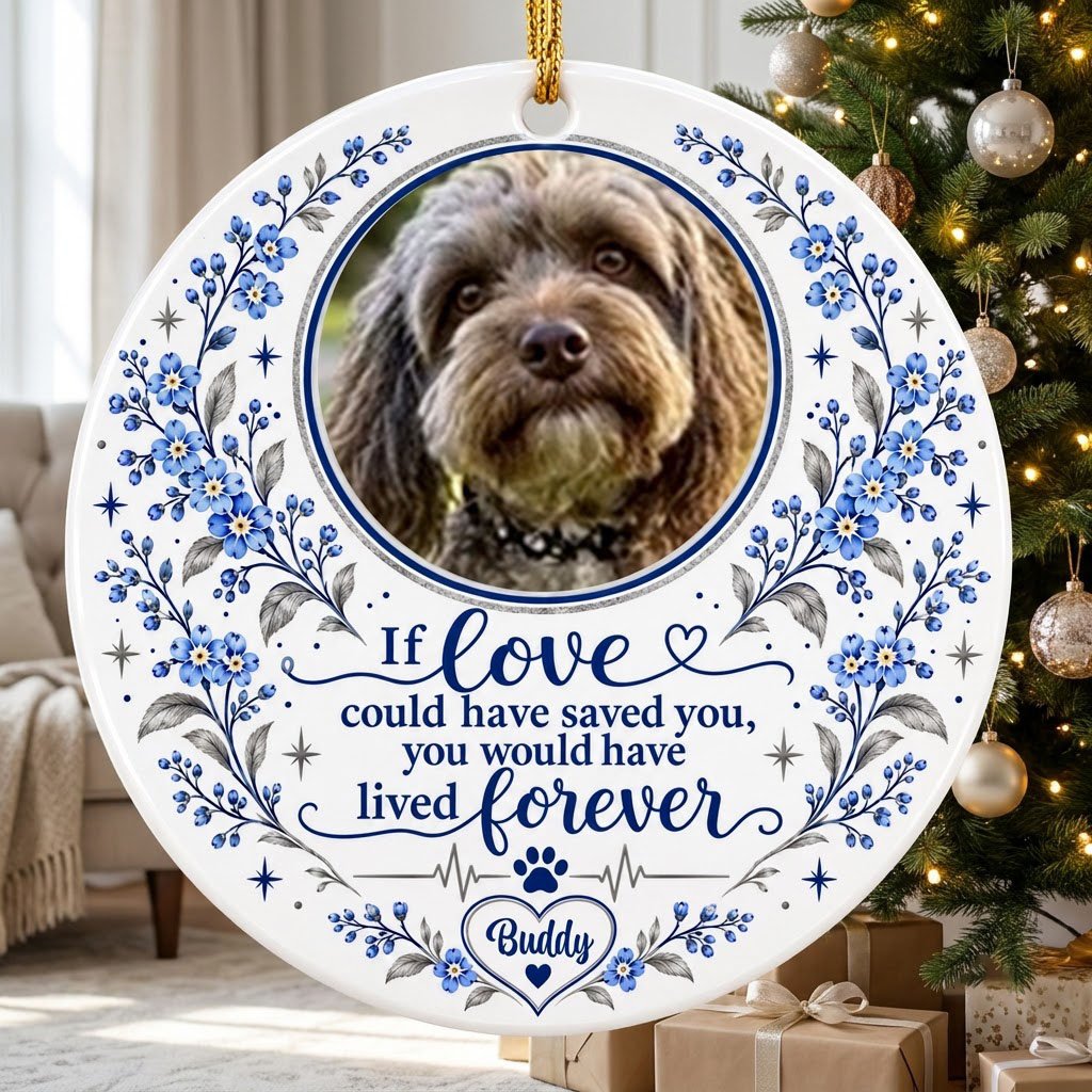 Round ceramic ornament with pet photo, blue forget-me-not florals, paw heartbeat line, and memorial quote.