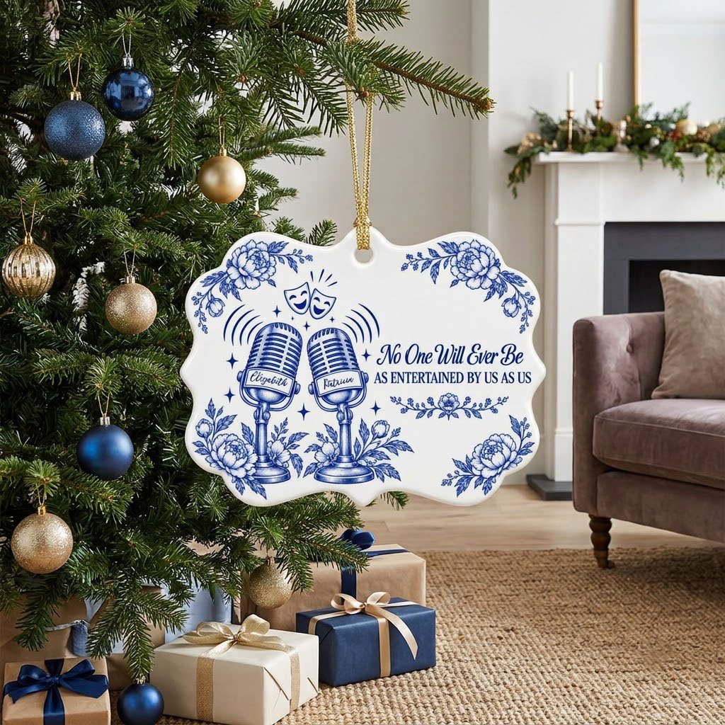 White ceramic ornament with cobalt blue vintage microphones, comedy and tragedy masks, stars and florals with two names.