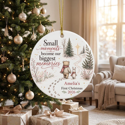 Round ceramic ornament with bear and bunny in scarves on snowy path, trees, star, quote, and personalized name and year.