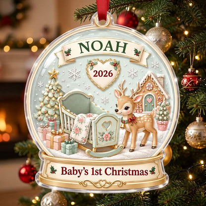 Acrylic snowglobe ornament with Baby's 1st Christmas, fawn with red bow, cradle, tree, gifts and gingerbread house