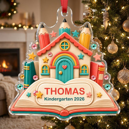 Clay-style schoolhouse on an open book with pencils and stars, personalized with child's name and Kindergarten 2026