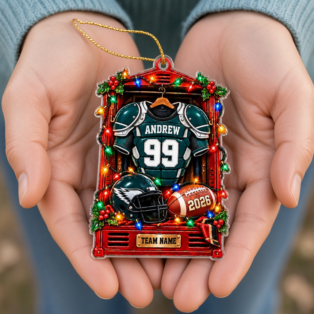 Acrylic ornament of a red football locker with a green jersey, helmet, football, lights and holly for Christmas