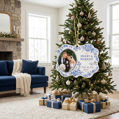 Scalloped ceramic ornament with blue floral border, 'MERRY & MARRIED', gold rings and bells, and a couple photo frame.