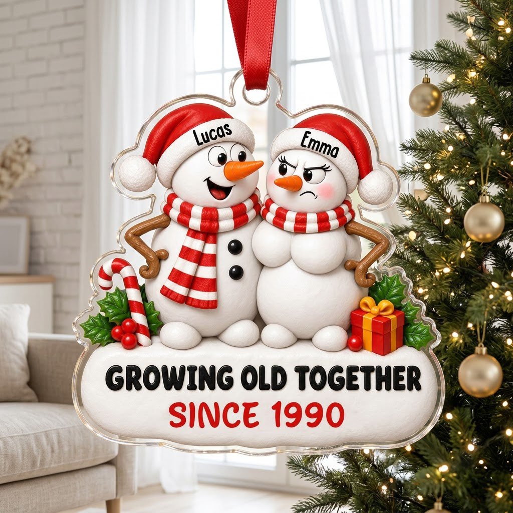 Custom-cut acrylic ornament of a snowman couple with candy cane, gift box, and Growing Old Together text on a snowy base