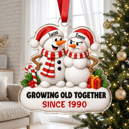Custom-cut acrylic ornament of a snowman couple with candy cane, gift box, and Growing Old Together text on a snowy base