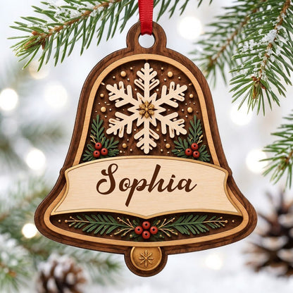 Personalized wooden bell ornament with snowflake, pine sprigs, red berries, and a name on the center banner.