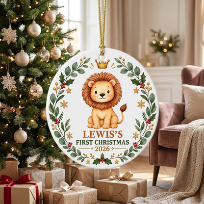 Round ceramic ornament with a cute crowned lion inside a festive wreath of green leaves, red berries, stars and snowflak