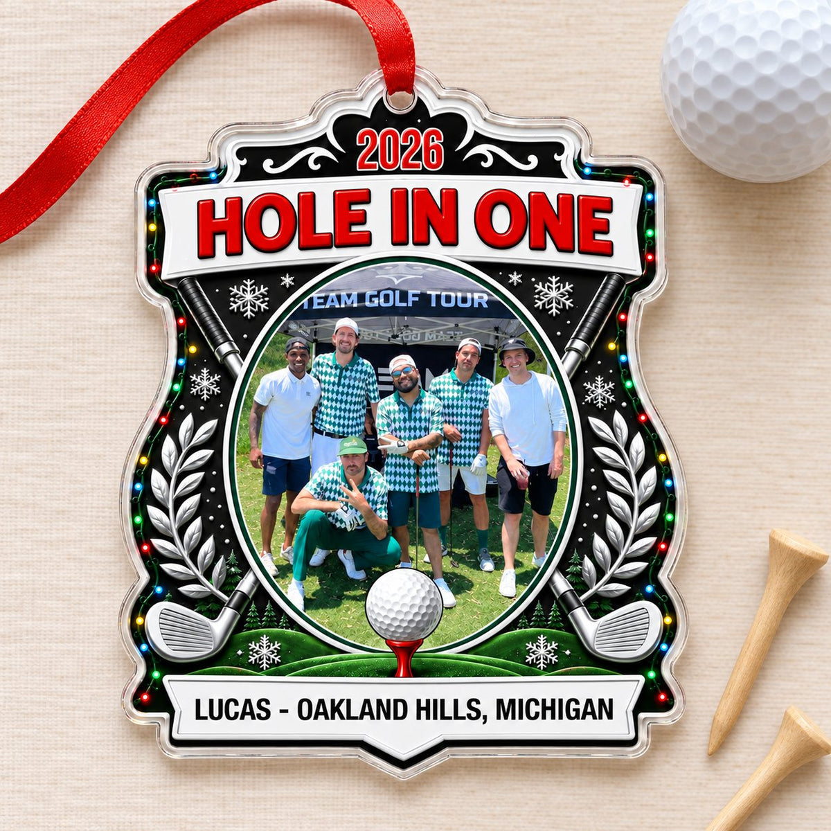 Acrylic crest ornament with golf photo, crossed clubs, Christmas lights, snowflakes, and HOLE IN ONE 2026 text.