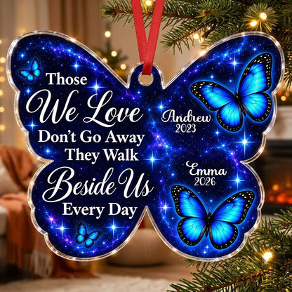 Butterfly-shaped ornament with blue butterflies and a galaxy background, reading Those We Love Don't Go Away.