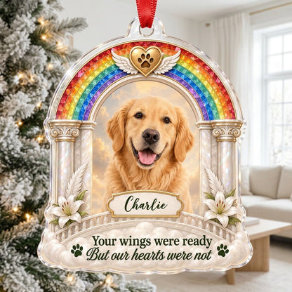A rainbow arch pet memorial acrylic ornament with a winged golden heart, paw print, lilies, pillars, clouds and a photo 