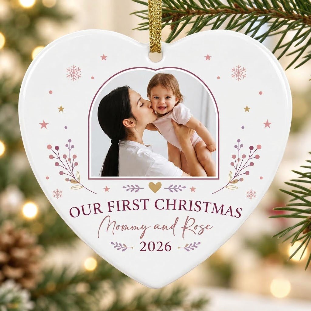 Heart ceramic ornament with “OUR FIRST CHRISTMAS”, arch photo frame, stars, snowflakes, berry sprigs, leafy flourishes, 
