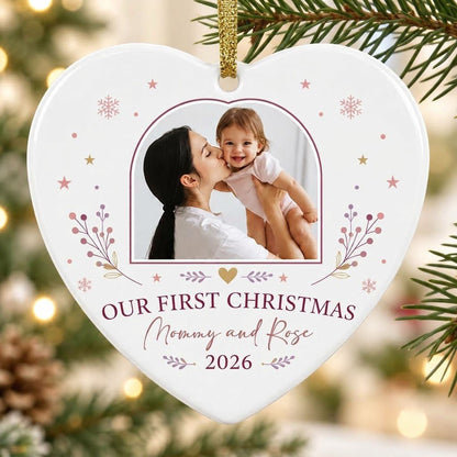 Heart ceramic ornament with “OUR FIRST CHRISTMAS”, arch photo frame, stars, snowflakes, berry sprigs, leafy flourishes, 