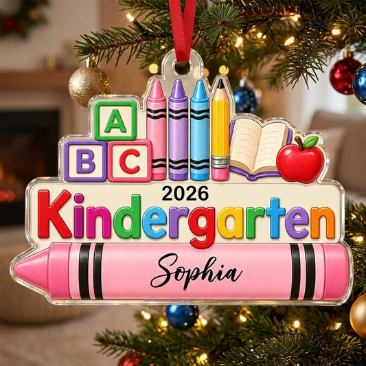 Clear acrylic ornament with ABC blocks, crayons, apple, open book and 'Kindergarten 2026' with a pink name banner