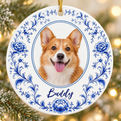 Round ceramic ornament with blue Delft floral border framing a circular photo of a dog and a personalized name.
