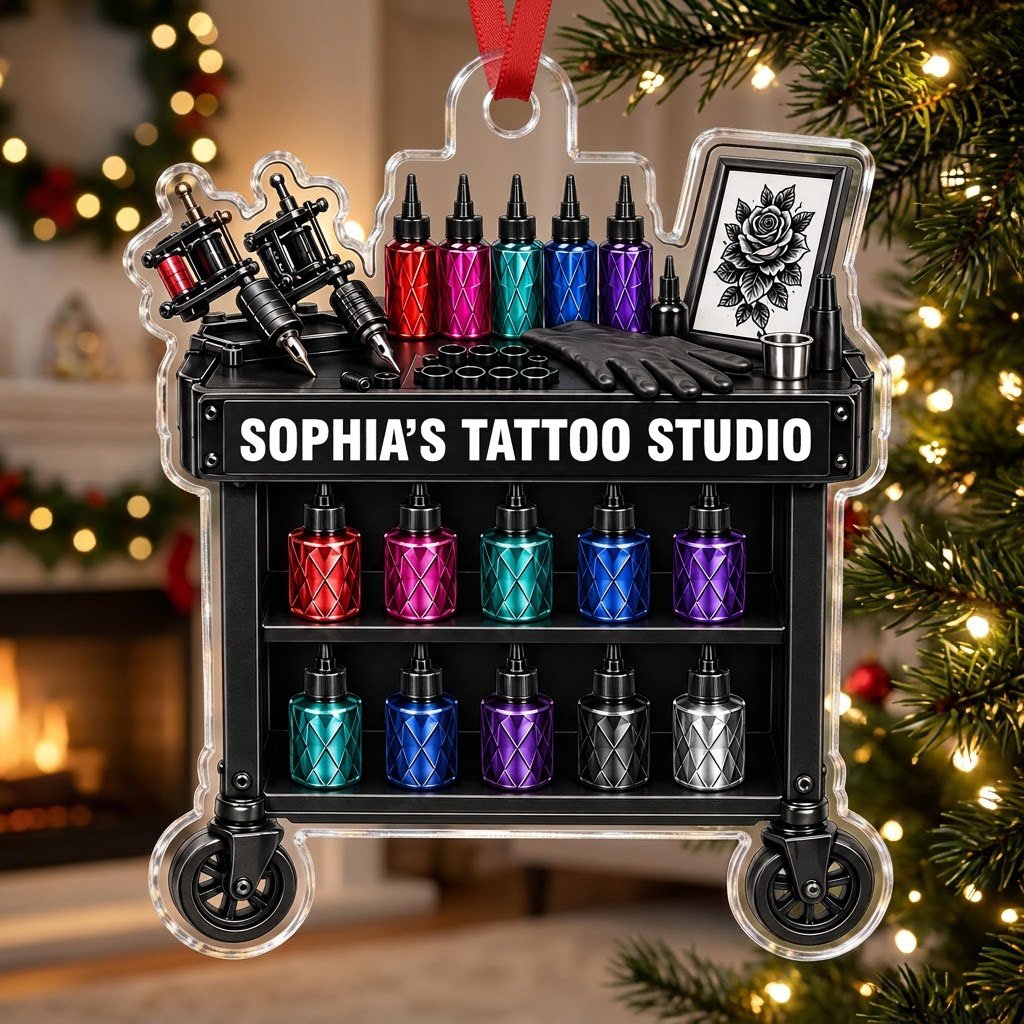 Acrylic ornament shaped like a tattoo cart with machines, colorful inks, and 'SOPHIA'S TATTOO STUDIO' text.
