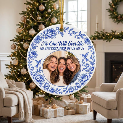 Round white ceramic ornament with blue floral border, two hummingbirds and a central circular photo frame with friends.