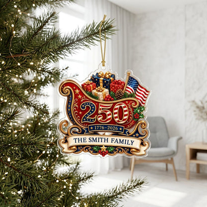 Acrylic ornament shaped like a Santa sleigh with '250', '1776-2026', US flag and a family name banner.