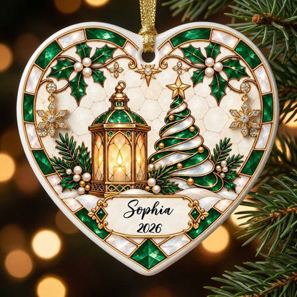 Heart ornament with emerald stained-glass border, gold lantern, spiral tree, holly, and a name-and-year scroll plaque.
