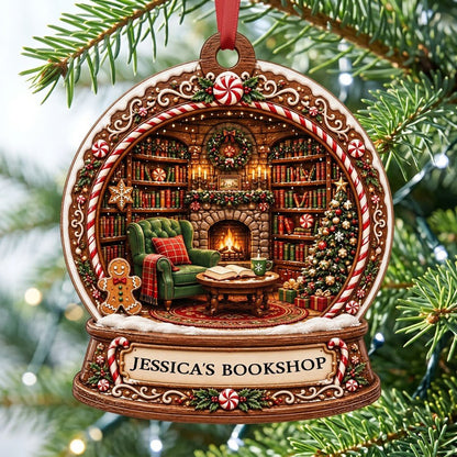 Snow globe ornament with candy-cane frame, cozy book-filled library, fireplace, tree, and 'JESSICA'S BOOKSHOP' nameplate