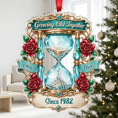 Custom-cut acrylic ornament with jeweled hourglass, red roses, and the words 'Growing Old Together'.