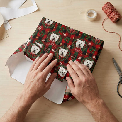 Red and green plaid wrapping paper with Westie in wreaths, snowflakes, stars, holly, and a name on red banners.