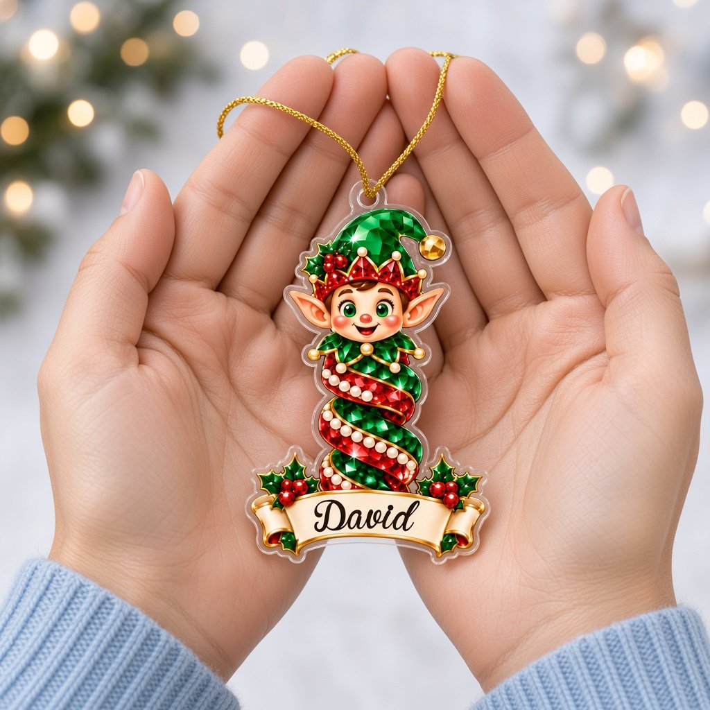 Acrylic ornament with green gift box and smiling elf, jeweled spiral columns, holly, and a name banner.