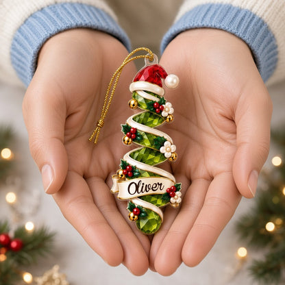 Acrylic ornament shaped around two green gem-style Christmas trees with holly, berries and names Oliver and Emma.