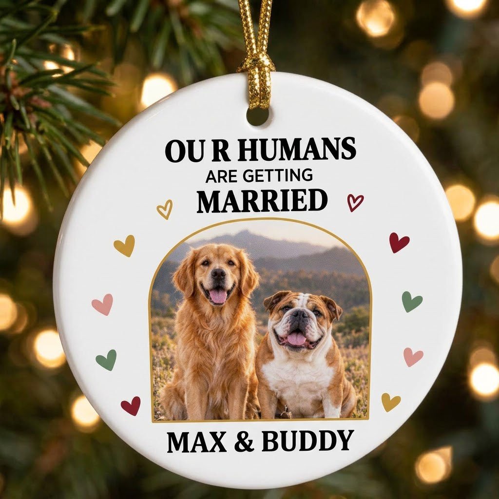 Round ceramic ornament with arch dog photo, “OUR HUMANS ARE GETTING married” text, and colorful heart accents.