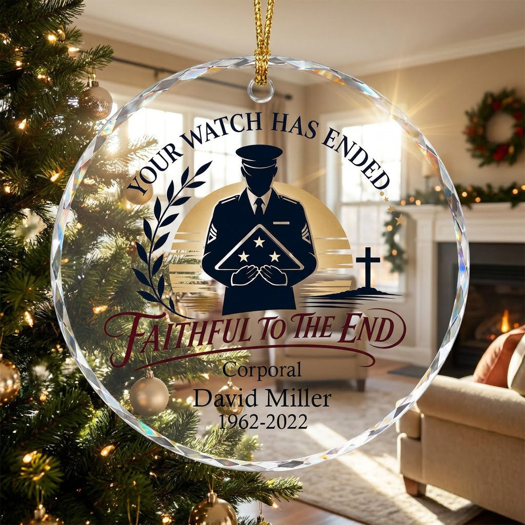 Round glass ornament with officer silhouette holding a folded flag, golden sunset, cross, and the words YOUR WATCH HAS E