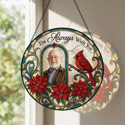 Round stained-glass style suncatcher with arched photo window, red cardinal, three red poinsettias and the words I'm Alw