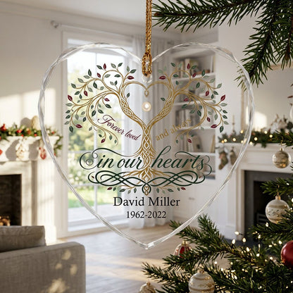 Heart glass ornament with a golden tree of life and the text 'Forever loved and always in our hearts'.
