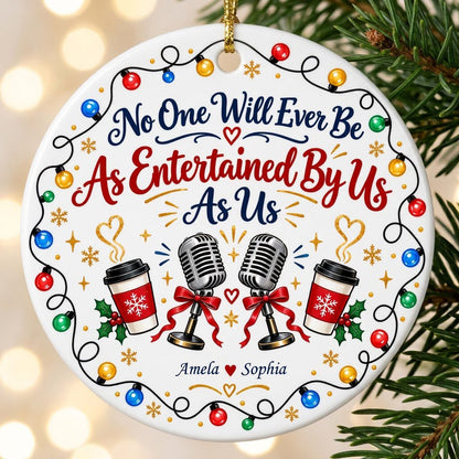 Round ceramic ornament with lights border, two microphones with red bows, and two coffee cups with heart steam.