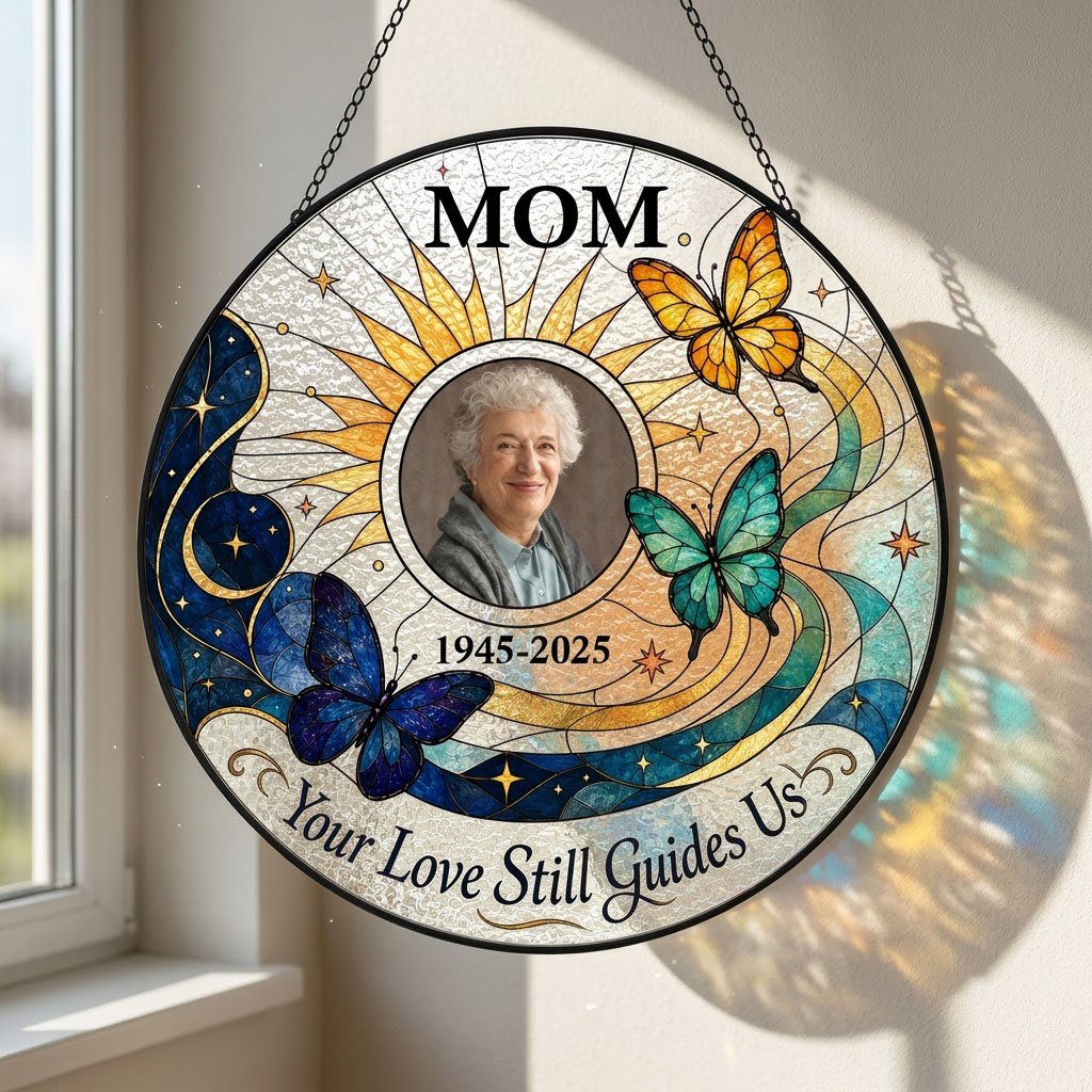 Round stained glass-style suncatcher with a photo frame, three butterflies, a crescent moon, sunburst rays and a banner 