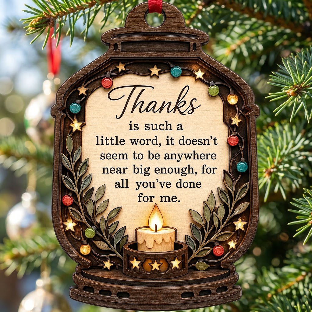 Lantern-shaped wood ornament with candle, colorful fairy lights, leafy branches, and a thank-you quote.
