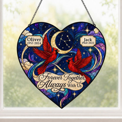 Heart stained glass suncatcher with two red cardinals, crescent moon, stars, clouds, and memorial name banners.