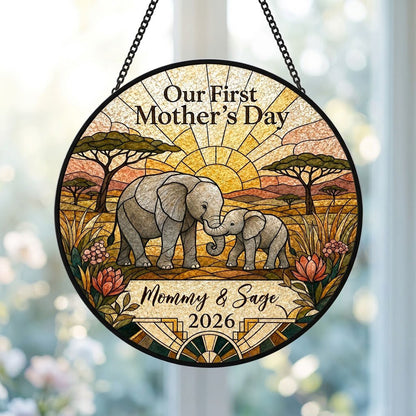 Stained glass-style mother and baby elephants at sunrise with 'Our First Mother's Day' text.