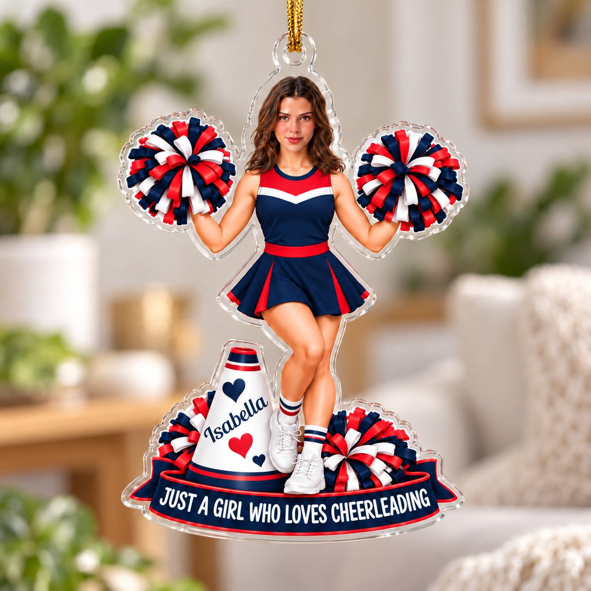 Custom-cut acrylic ornament of a cheerleader in red, navy and white with pom-poms, a megaphone and a name banner.